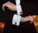 person-wearing-white-dress-shirt-and-black-and-white-beaded-bracelet