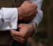 Man adjusts his cufflinks