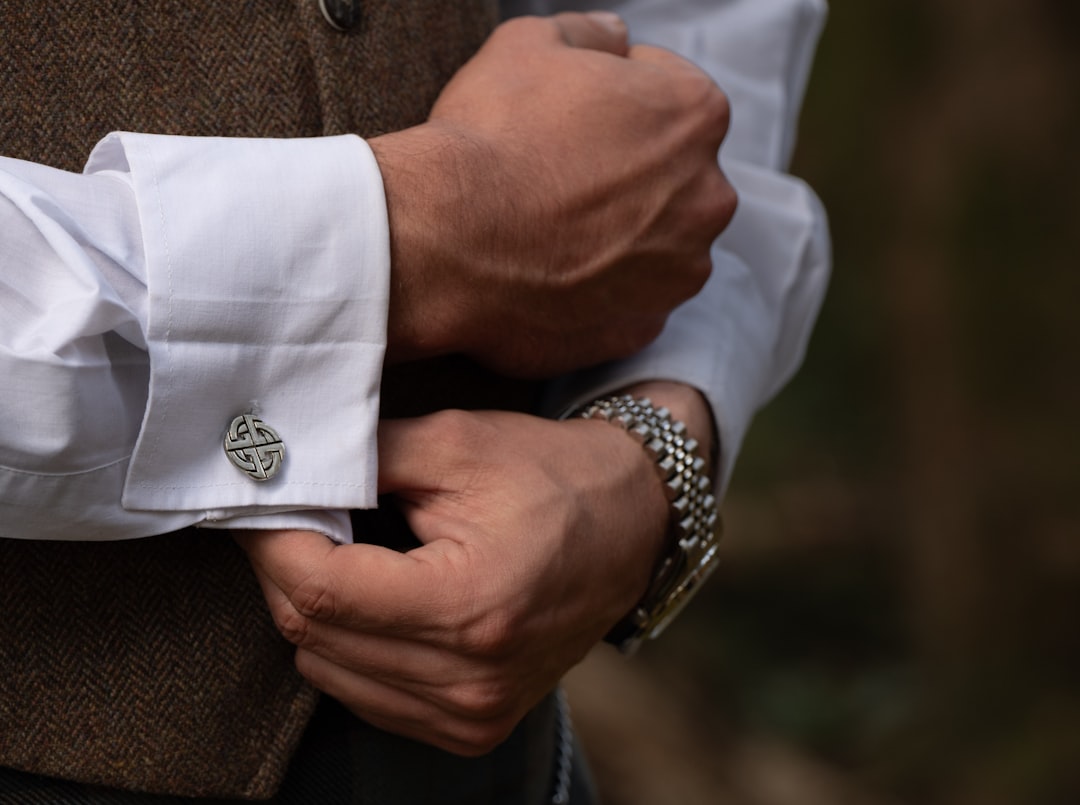 Man adjusts his cufflinks